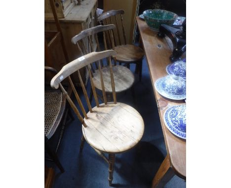 A SET OF SIX VICTORIAN STICK BACK KITCHEN CHAIRS, with circular seats