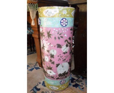 A CHINESE CYLINDER STICK STAND with pink ground, decorated with flowers and dragons (examine)