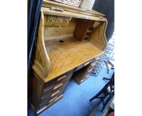 A REPRODUCTION AMERICAN LIGHT OAK ROLL-TOP OFFICE DESK 137 cm wide, and a matching swivel chair