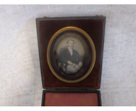 A MINIATURE PORTRAIT OF A GENTLEMAN SEATED in a fitted presentation case