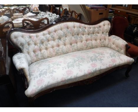 A VICTORIAN ROSEWOOD BUTTON BACK SOFA, with carved show frame, 180 cm wide