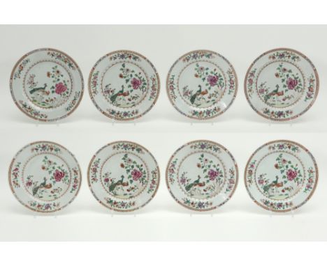 series of eight 18th Cent. Chinese plates in porcelain with a 'Famille Rose' decor with peacocks in garden || Serie van acht 