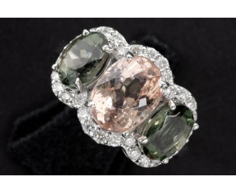 handmade ring in white gold (18 carat) with a ca 4 carat light pink morganite, ca 3,60 carat of moss-green turmalines and at 