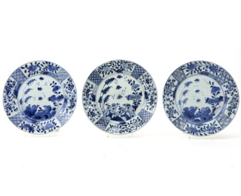 series of three 18th Cent. Chinese plates in porcelain with a blue-white decor with birds and flowers || Serie van drie achtt