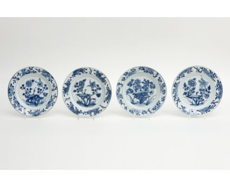 Series of four 18th Cent. Chinese plates in marked porcelain with a blue-white garden decor || Serie van vier vroeg achttiend