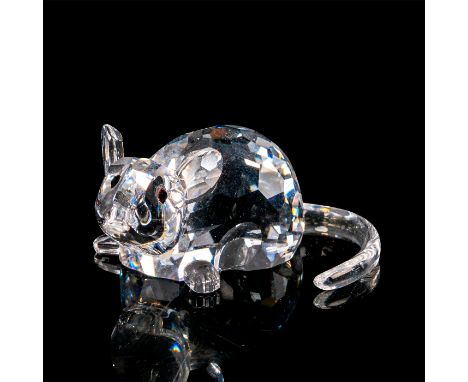 This crystal rat is a part of the Chinese Zodiacs collection. The rat is lying flat on its stomach with two paws projecting o