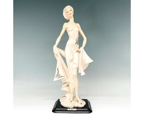 Beautiful figurine modeled as a graceful woman with cropped haircut dressed in a form fitting evening gown and sash; gold det