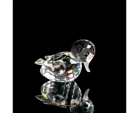 This duck figurine is shown midswim and is made of clear crystal. It is part of the "Beauties of the Lake" theme. Its head is