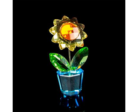 Faceted crystal figurine modeled as a sunny yellow flower with green leaves and blue pot. Swarovski acid mark to base. This i