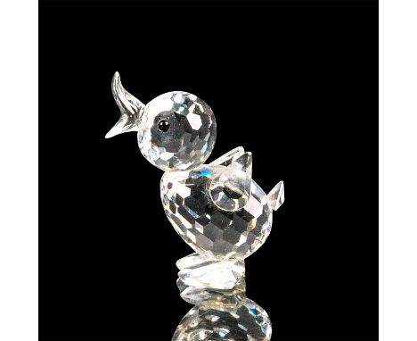 This duck figurine is made of clear crystal. This drake is standing up on its feet with its wings and tail pointed upwards. I