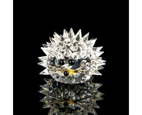 This miniature hedgehog is made of clear crystals and covered in pointed spines with a flat base. Black crystals are used for