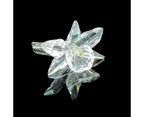 A single stunning blossomed orchid in clear faceted crystal with a pale yellow center. Swarovski acid mark. This item has its