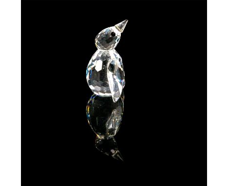This miniature penguin is part of the ""Kingdom of Ice and Snow"" Collection. The penguin has a clear body with black crystal