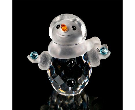 Small faceted crystal figurine modeled as a tiny snowman holding light blue snowballs in each hand. Figurine has a frosted cr