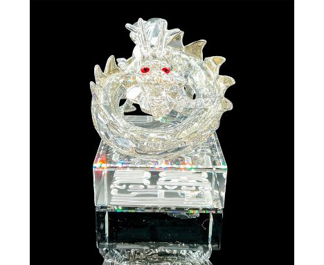 Lead crystal 1st generation zodiac dragon in a crystal silver shade with red crystal eyes atop a clear crystal base which fea