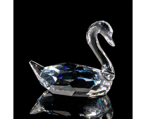 Colorless crystal swan figurine with faceted body and graceful molded crystal neck. Swarovski acid mark to base. This item ha