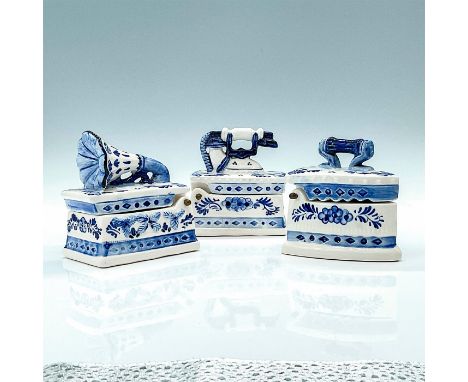 Small hand painted boxes with blue and white floral decorations. Each item in a different shape; telephone, gramophone, and i