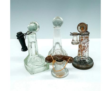 Three candlestick types and one bell-shaped handset. Largest has measurements of 2 in. L x 2 in. W x 5 in. H. Country of Orig