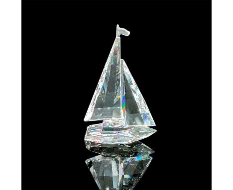 Clear faceted crystal boat with sails and a flag atop. Swarovski acid mark. This item has its original box: 6.25in W x 4.75in