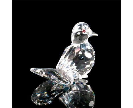 Tiny faceted crystal figurine modeled as a dove with a fanned tail, pink crystal eyes, and tiny frosted feet. Swarovski acid 