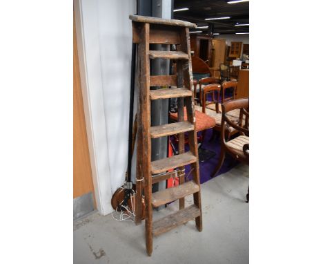 A set of vintage wooden stepladders, tree lopper and two traditional warming pans