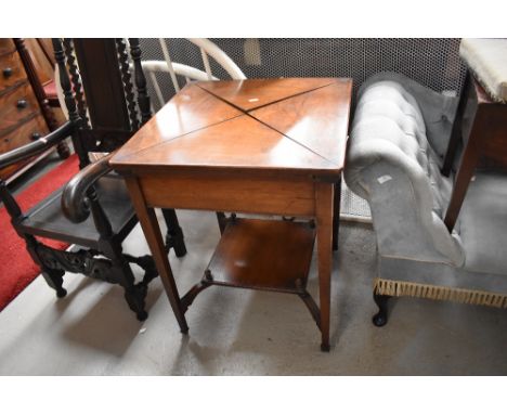 A Victorian mahogany envelope card table, having square tapered legs, red beize interior in need of attention, width approx. 