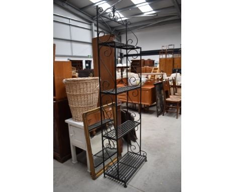 A modern wrought iron shelf, height approx. 210cm