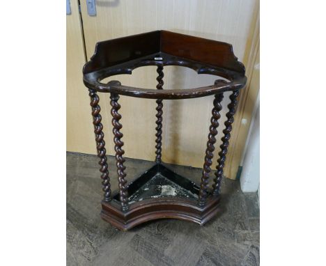 A mahogany barley twist column corner stick stand with drip tray inset