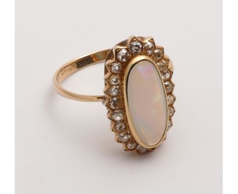 Large oval opal and diamond cluster ring, in yellow gold ring size S