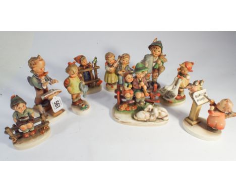 A collection of 9 Goebel Hummel figurines of children