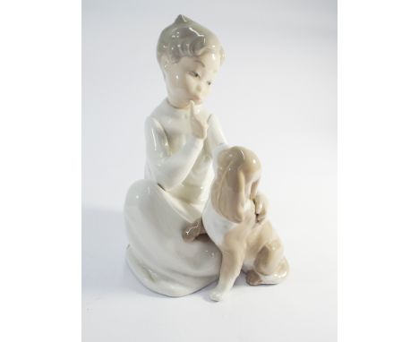A Lladro figure of a child with a puppy 22cms tall