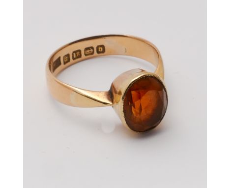 Victorian 18ct yellow gold ring set with oval fire opal in a mill grain rub over setting Size 'O'