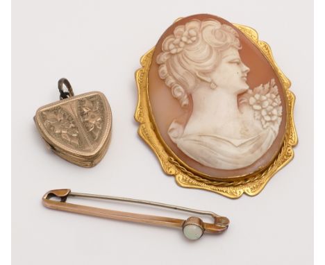 A large 9ct gold framed shell cameo brooch, 9ct gold bar brooch set with an opal and a gilt metal locket