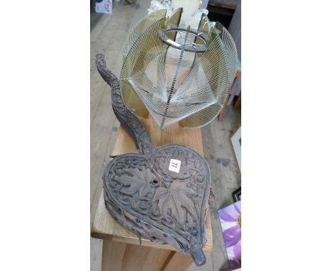 Old pair of bellows in a heart shape and a retro light shade 