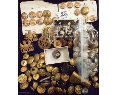A collection of various military badges, buttons, insignia and trench art