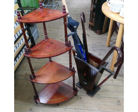 Art deco shaped stick stand containing 3 wallking sticks, umbrella and a four tier whatnot 