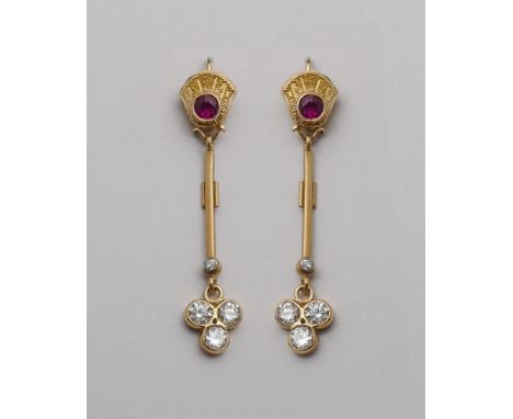 A pair of 18ct yellow gold ruby and diamond drop earrings, with a circular ruby set to the top with gold drop bar and trefoil