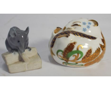 Royal Crown Derby paperweight of a doormouse together with a Royal Copenhagen miniature model of a mouse eating cheese 