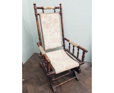 American walnut framed rocking elbow chair with tapestry seat and back 