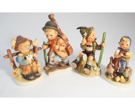 Four Goebel Hummel figurines of children