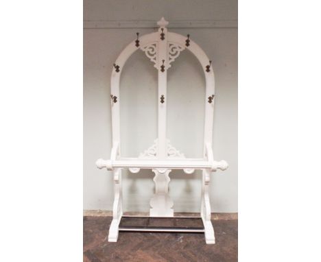 Very large Victorian white painted hall stand with open work arch back, brass coat hooks and stick stand with drip stand unde