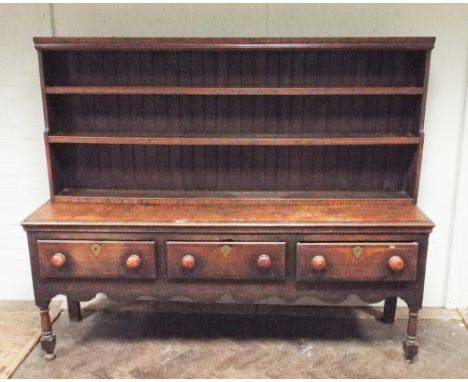 Georgian oak dresser base with fitted 3 deep drawers with shaped apron and later closed shelf back, base measures 201cm acros