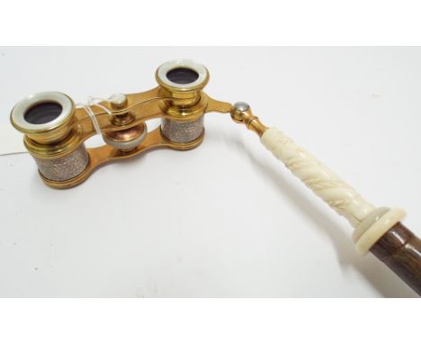 Collectable walking cane with French gilt metal and engine turned opera glasses inset to the top 