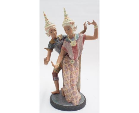 A large Lladro figurine of Thai dancers 53cms tall       Male dancer has restoration to fingers