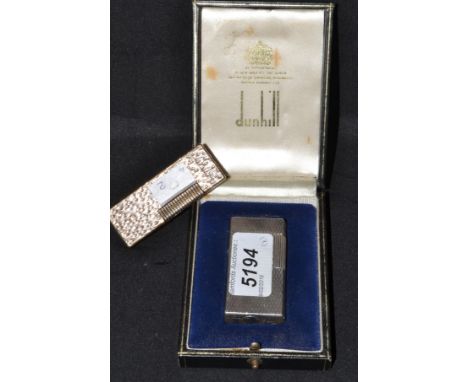 A Dunhill Y787 engine turned pocket lighter, associated Dunhill case; another 24163