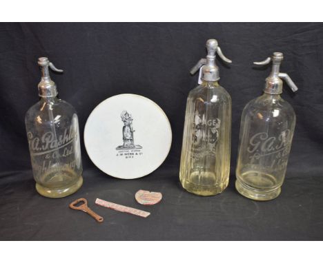 Advertising - a soda syphon, Noel Page Ltd, Loughborough; a pair of soda syphons, G A Pashley, Loughborough; a ceramic trivet