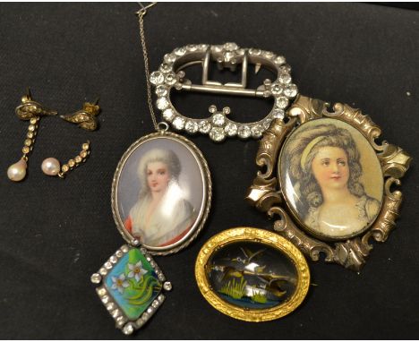 A 19th century portrait/mourning brooch, lady of fashion, painted on silk, hair and seed pearl arrangement to reverse, yellow