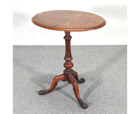 A Victorian walnut occasional table, with an oval top, on a fluted column and tripod base66w x 52d x 73h cmOverall complete a