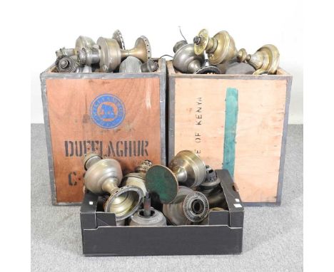 A collection of brass oil lamp fonts