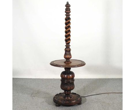 An early 20th century carved oak standard lamp, with a baluster column, 150cm highOverall solid and well made. Dirty and has 